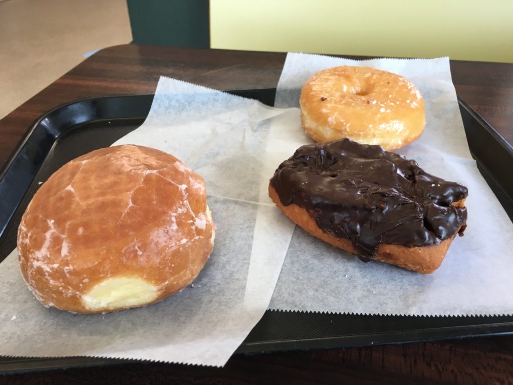 Raspberry Filled, Chocolate frosted buttermilk, glazed ring.