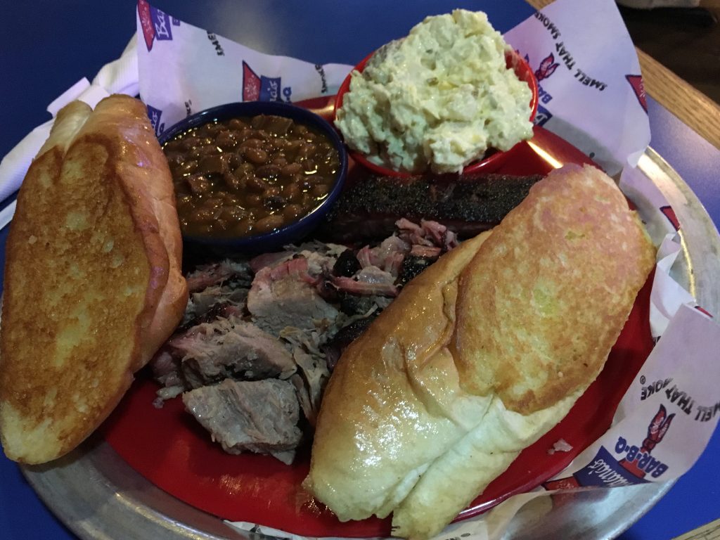 Everything on the plate dwarfed by massive shoe sized breads.