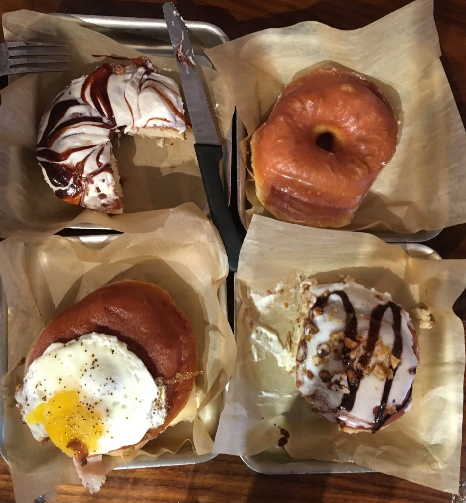 CW from top left: Cinnamon roll, Glazed, Chunky Monkey, Croquenut Madame