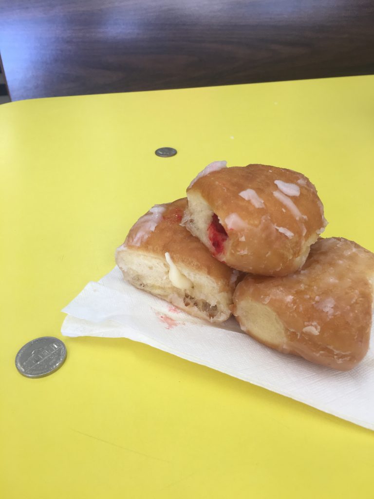 Filled donut holes. Nickel for scale.